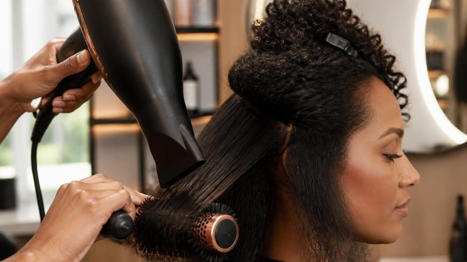 Blow drying curly hair straight without wrecking it — shown step by step in this guide