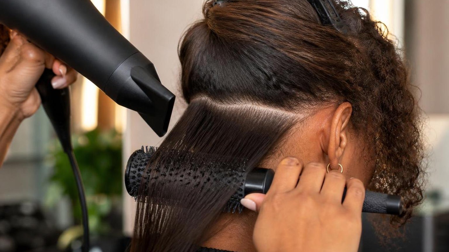 Blow drying curly hair straight without wrecking it — shown step by step in this guide