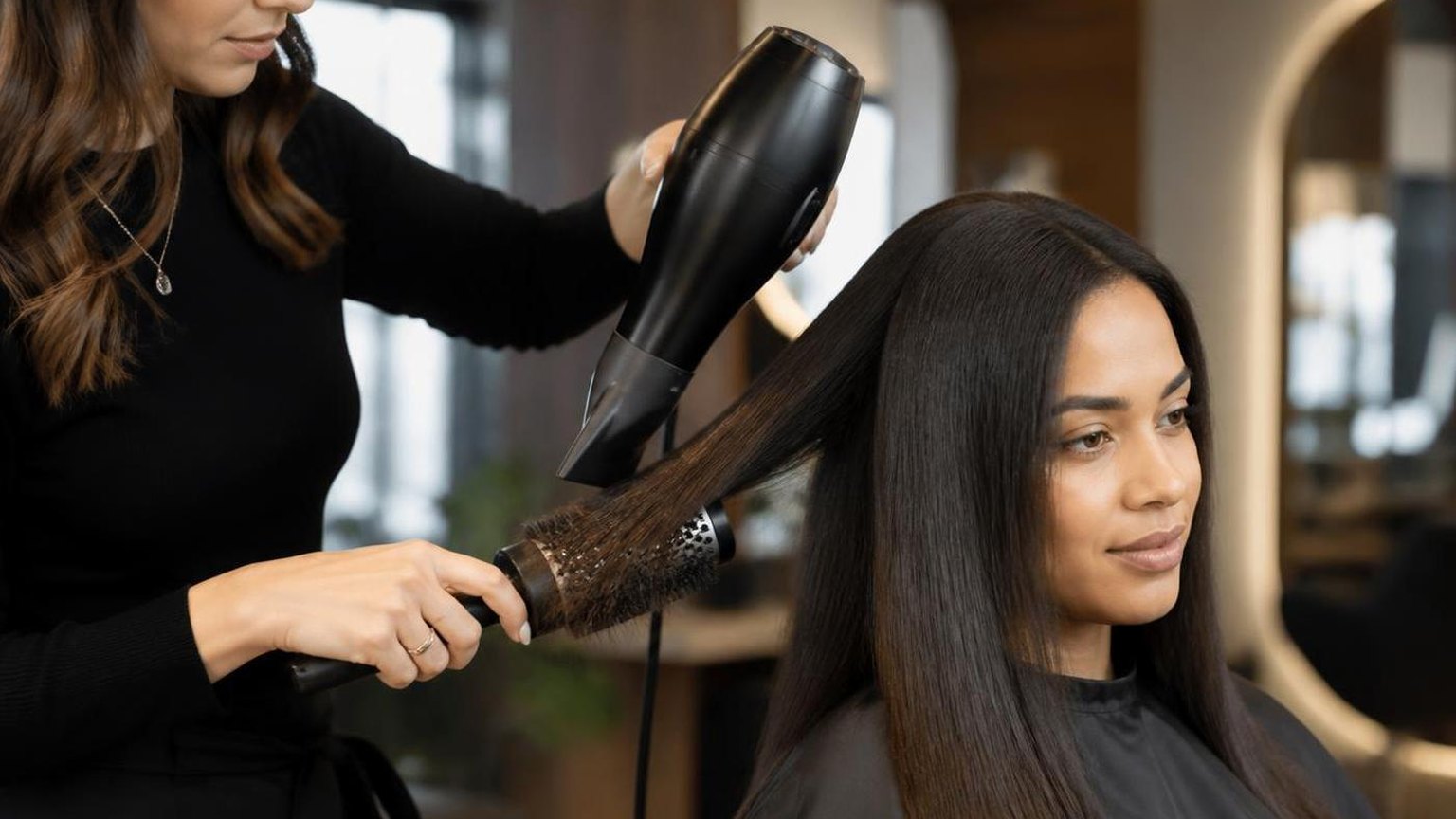 Blow drying curly hair straight without wrecking it