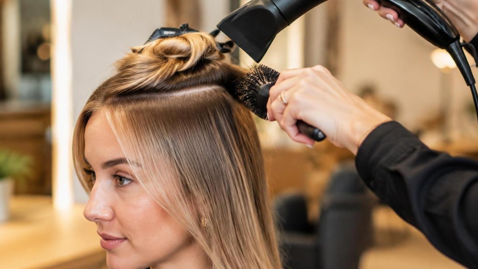 Side-by-side of two finishes on the same hair type, during a real blow dry